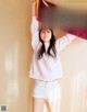 A woman holding up a flag that says Rakuten Eagles.